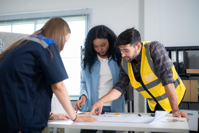 engineers, architects, and designers collaborate to design a bui